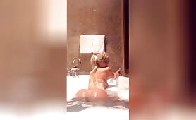 Sexy blonde shows off perfect ass while in bathtub
